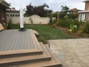 Ottawa Composite Deck in a Landscaped Backyard by Ottawa Deck Builder
