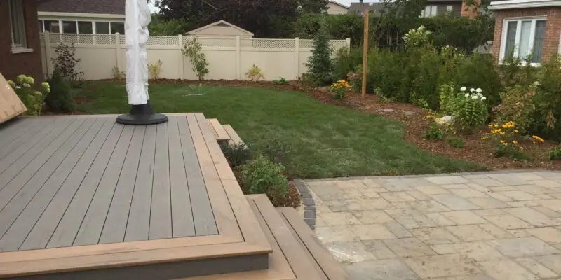Ottawa Composite Deck in a Landscaped Backyard by Ottawa Deck Builder
