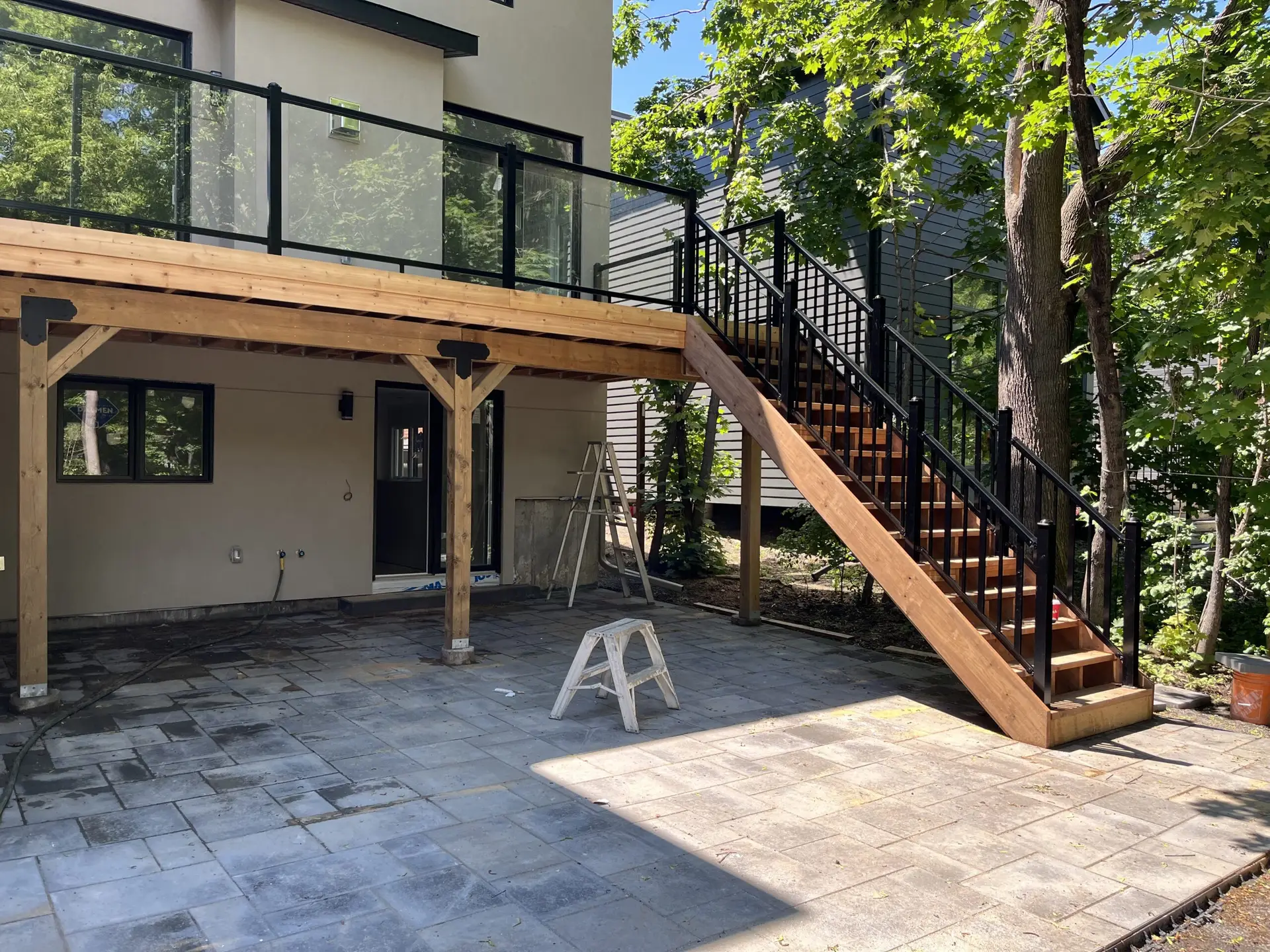 A 2nd story deck in Westboro with aluminum glass railing finished with cedar deck boards
