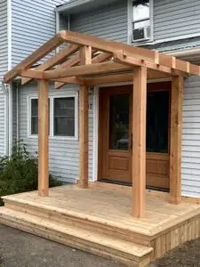 A cedar deck in Metcalfe complete with a douglas fir timber frame roof
