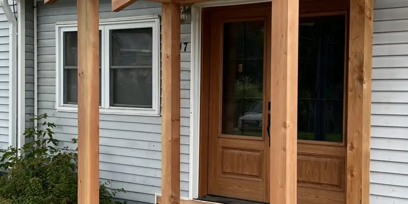 A cedar deck in Metcalfe complete with a douglas fir timber frame roof
