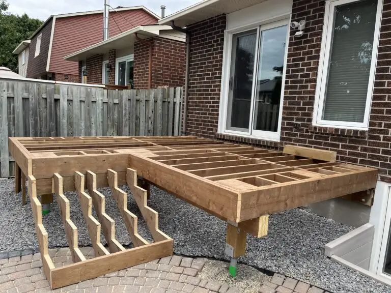The frame for this PVC deck is complete with custom cut stair stringers