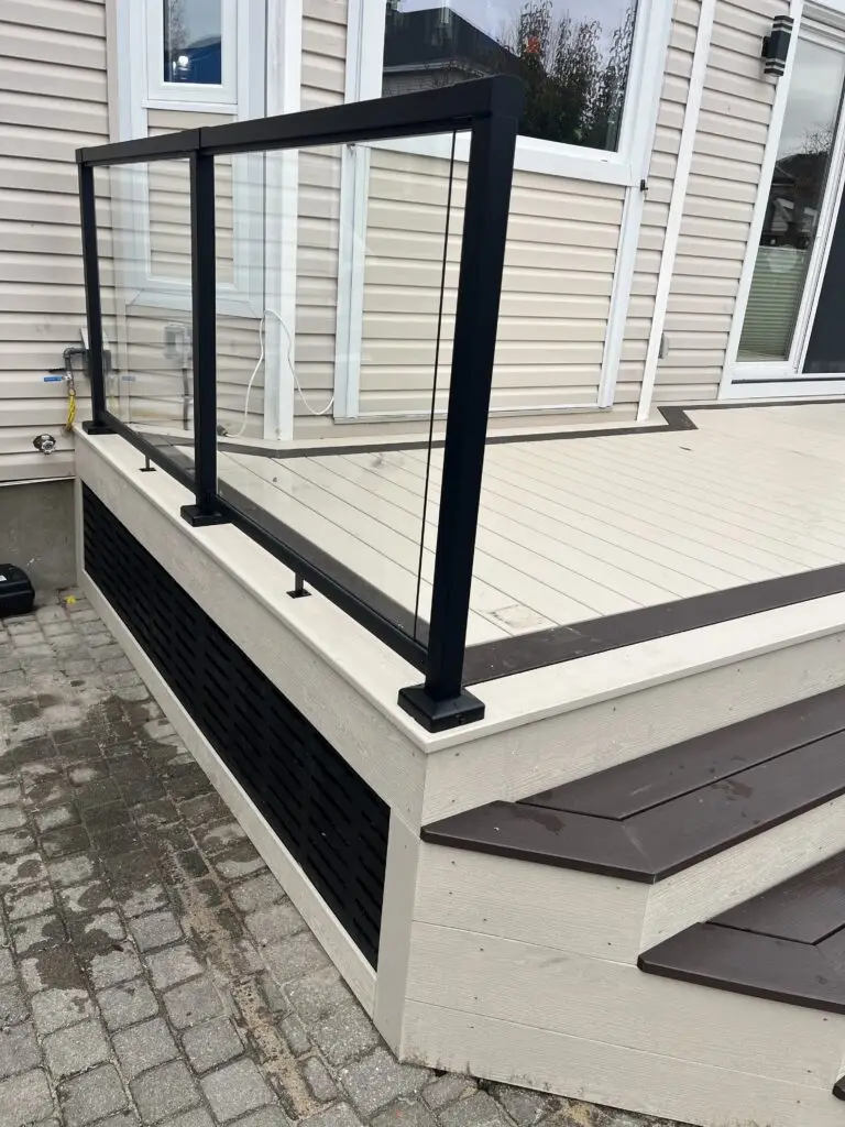 Clubhouse curved PVC deck with glass railing and black pvc skirting. Deck railing Ottawa