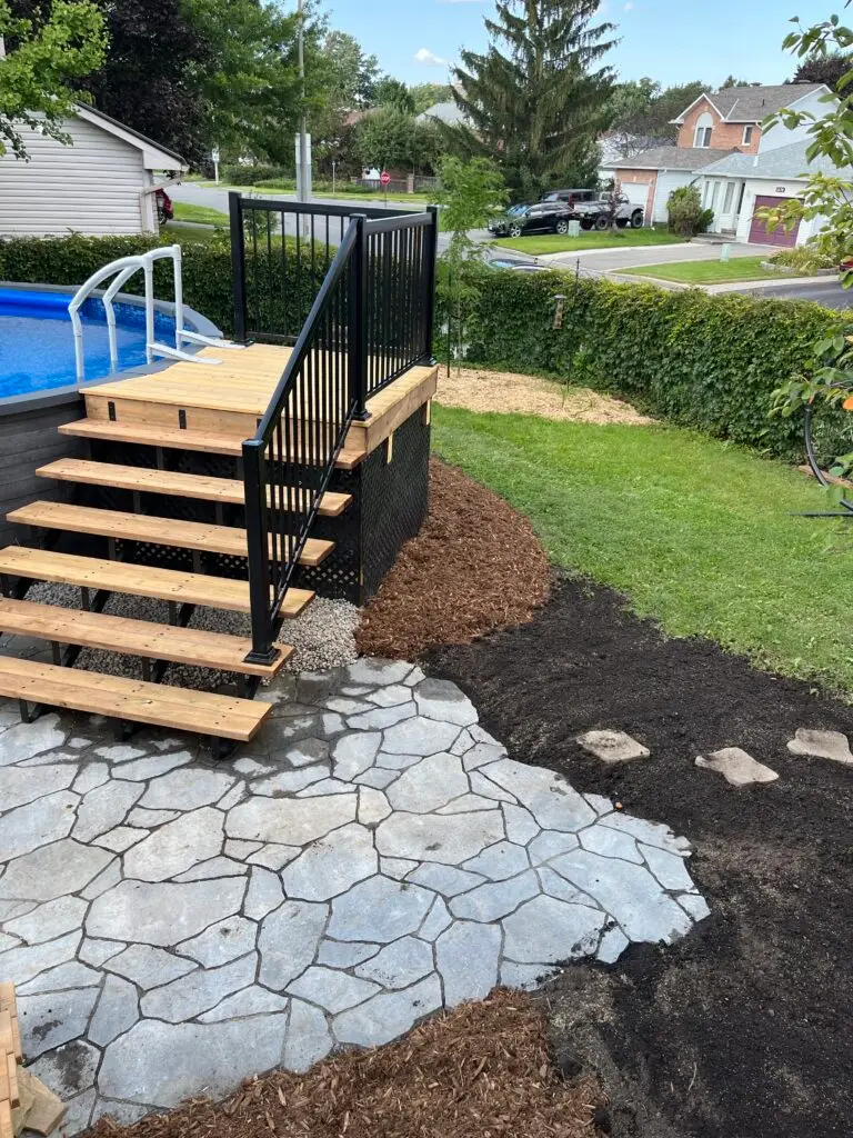 An interlock patio extends the living space for this pool deck in Gloucester