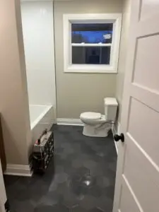 Project complete. The bathroom has a modern octagon floor tile