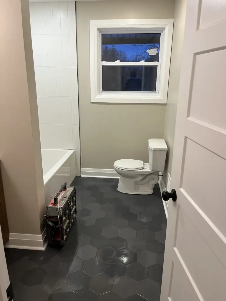Project complete. The bathroom has a modern octagon floor tile