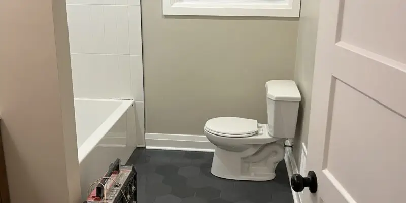 Project complete. The bathroom has a modern octagon floor tile