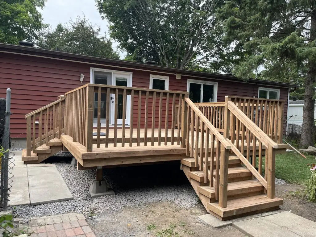 Richmond deck builder installs a pressure treated deck with railing